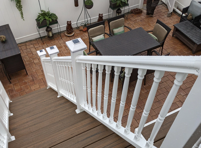 deck area with wooden stairs